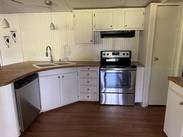 kitchen featuring stainless steel appliances, sink, white cabinets, hanging light fixtures, and range hood