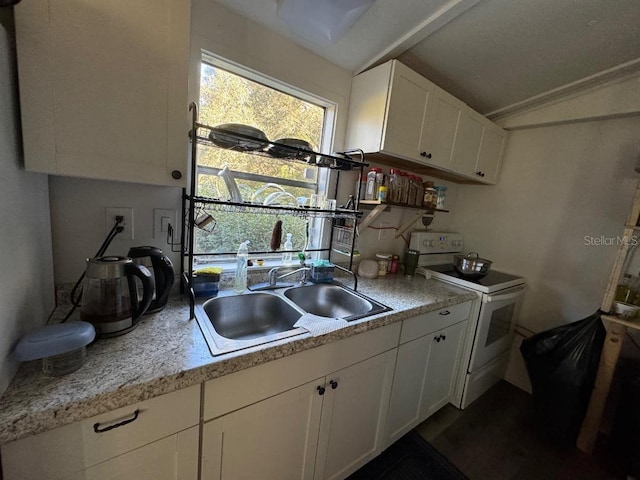 kitchen with white cabinetry, sink, and white electric range