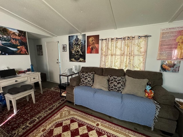 living room featuring a textured ceiling and lofted ceiling