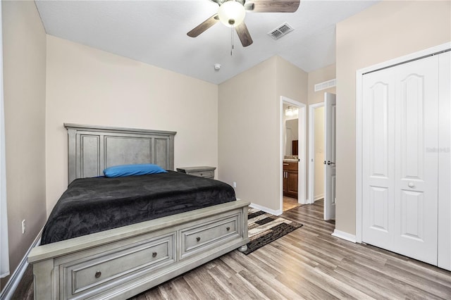 bedroom featuring ceiling fan, a closet, a textured ceiling, and light hardwood / wood-style flooring