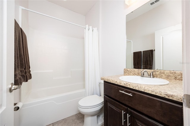 full bathroom featuring tile patterned floors, vanity, toilet, and shower / bath combo with shower curtain