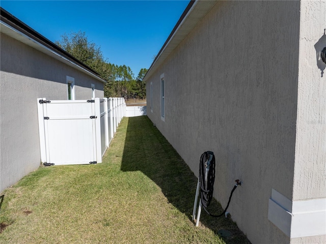 view of property exterior with a lawn