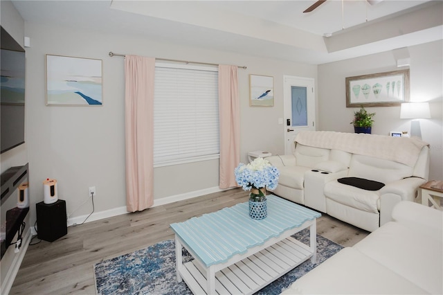 living room with ceiling fan and light hardwood / wood-style floors