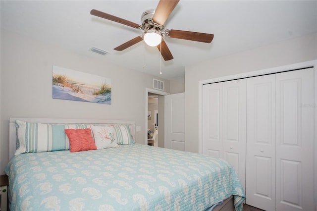 bedroom featuring ceiling fan and a closet