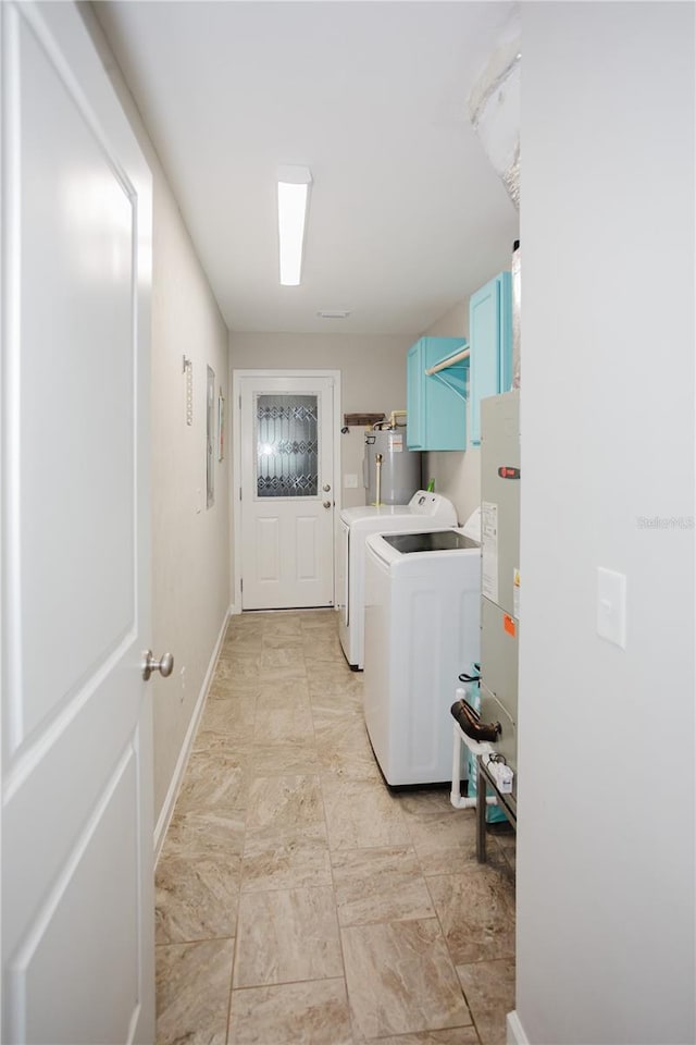 laundry room featuring separate washer and dryer and electric water heater