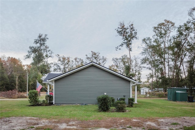 view of property exterior featuring a lawn