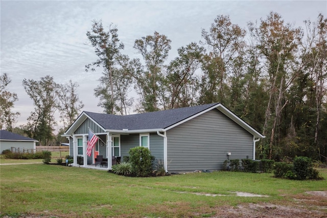 view of side of home featuring a lawn