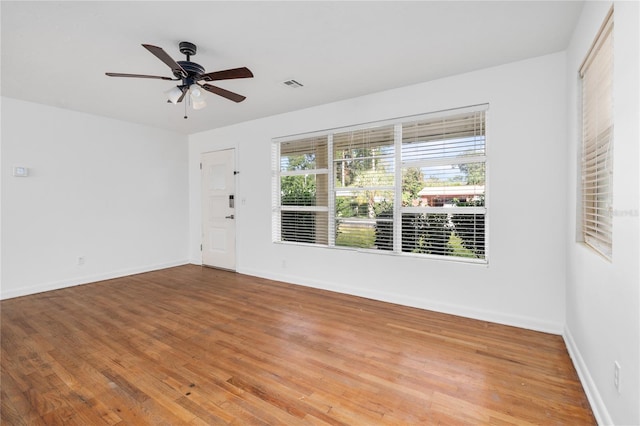 unfurnished room featuring hardwood / wood-style flooring and ceiling fan