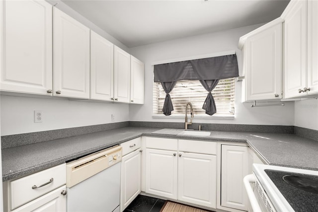 kitchen featuring dishwasher, white cabinetry, and sink