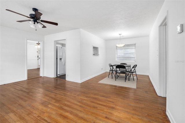 dining area featuring ceiling fan and hardwood / wood-style flooring