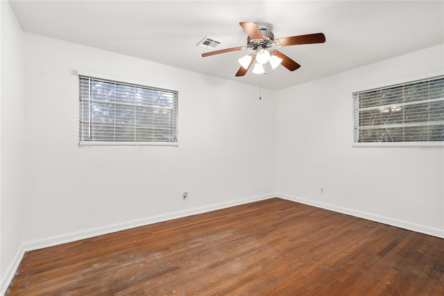 empty room featuring hardwood / wood-style floors and ceiling fan