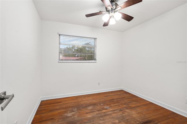 empty room featuring ceiling fan and dark wood-type flooring