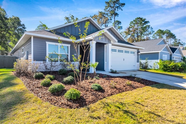 craftsman-style home with a front yard and a garage