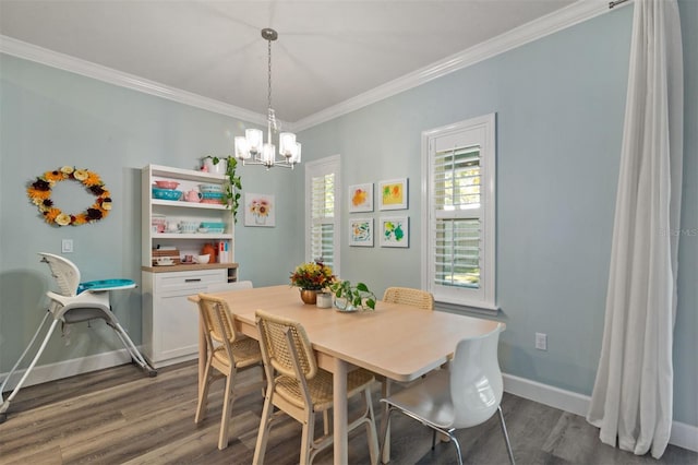 dining space featuring dark hardwood / wood-style flooring, a notable chandelier, and ornamental molding