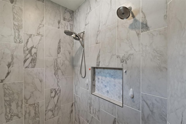 details featuring a tile shower