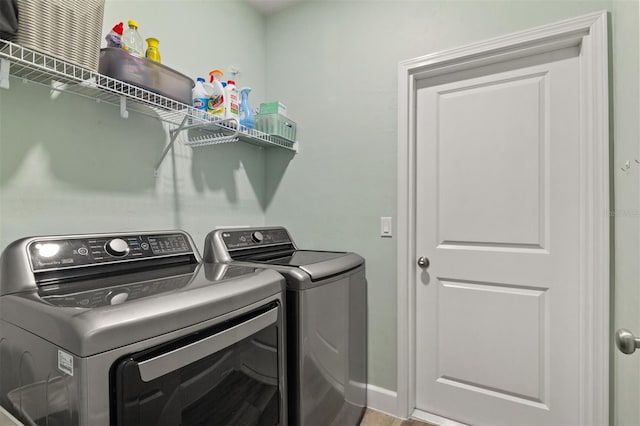 clothes washing area featuring washing machine and dryer