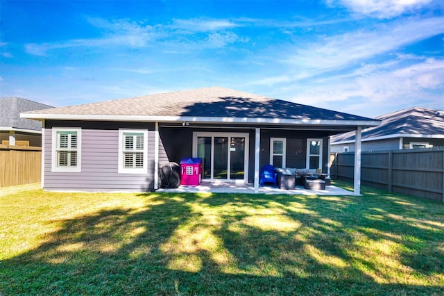 back of house with a yard, a patio, and an outdoor living space