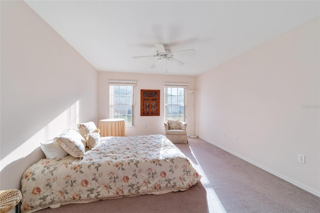 bedroom with ceiling fan and carpet floors