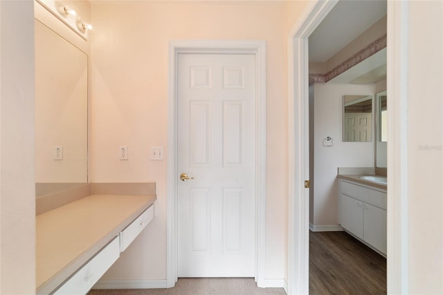 bathroom featuring vanity and wood-type flooring