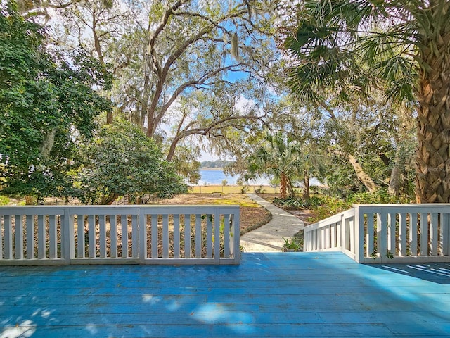 wooden deck featuring a water view