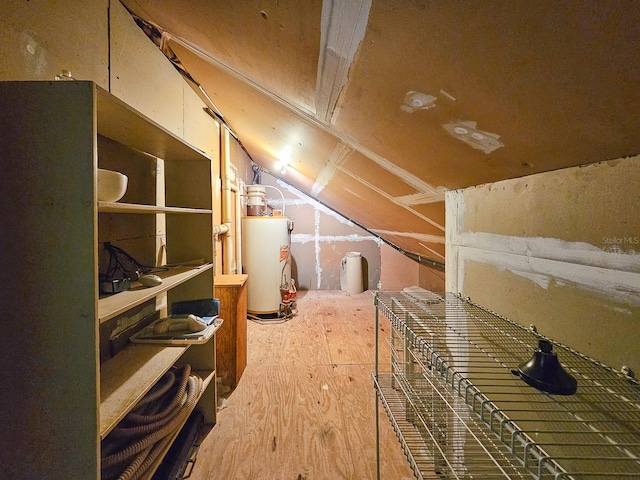 unfinished attic with gas water heater