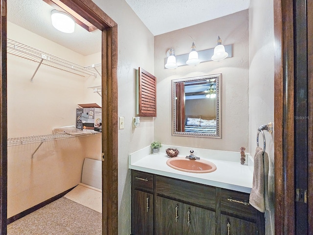 bathroom featuring vanity and a textured ceiling