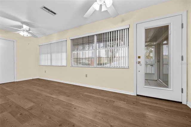 foyer featuring hardwood / wood-style flooring and ceiling fan