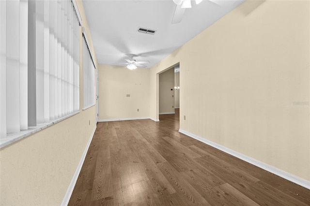 spare room featuring ceiling fan and hardwood / wood-style flooring