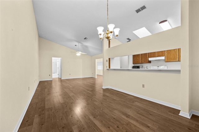 unfurnished living room with ceiling fan with notable chandelier, dark hardwood / wood-style flooring, and lofted ceiling