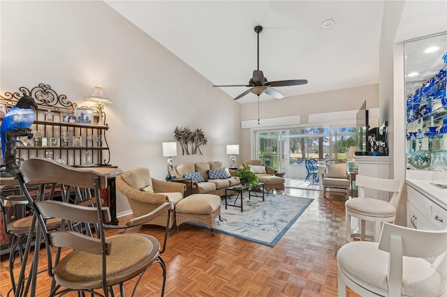 living room featuring ceiling fan, parquet flooring, and high vaulted ceiling