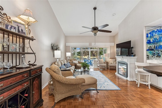 living room featuring light parquet flooring and ceiling fan