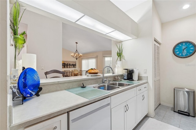 kitchen with white dishwasher, sink, decorative light fixtures, an inviting chandelier, and white cabinetry