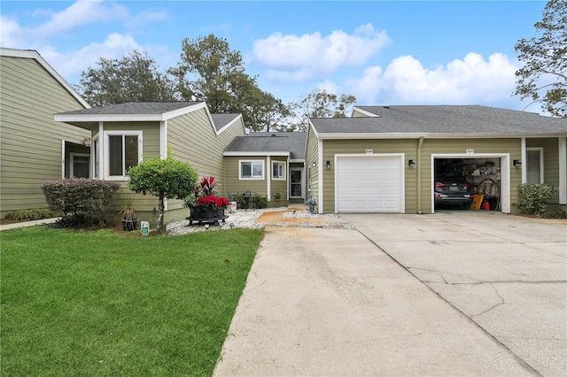 view of front facade featuring a garage and a front lawn