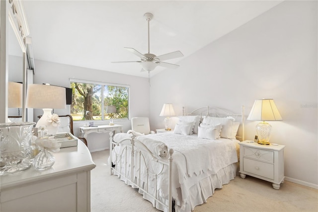 carpeted bedroom featuring vaulted ceiling and ceiling fan