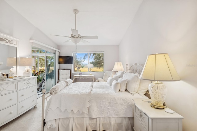 carpeted bedroom with access to exterior, ceiling fan, and lofted ceiling