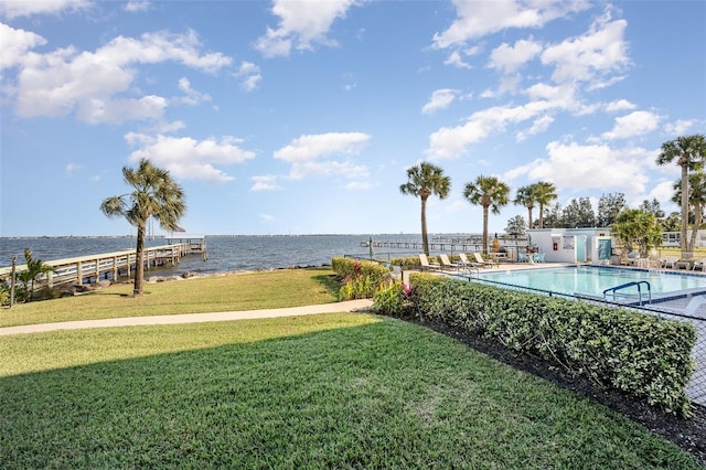 view of yard with a water view and a community pool