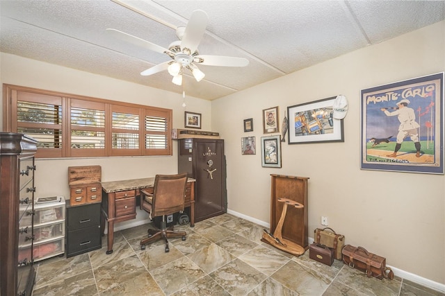 office space featuring ceiling fan and a textured ceiling