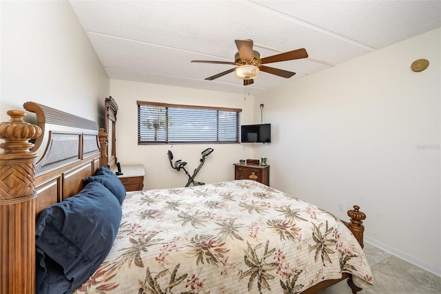 bedroom featuring ceiling fan and light carpet