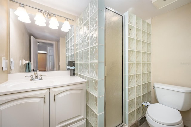 bathroom featuring vanity, toilet, tile walls, and a shower with shower door