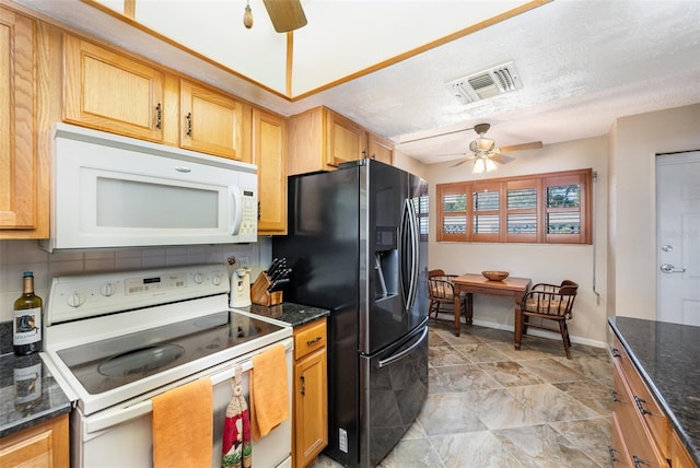 kitchen featuring backsplash, dark stone counters, a textured ceiling, white appliances, and ceiling fan