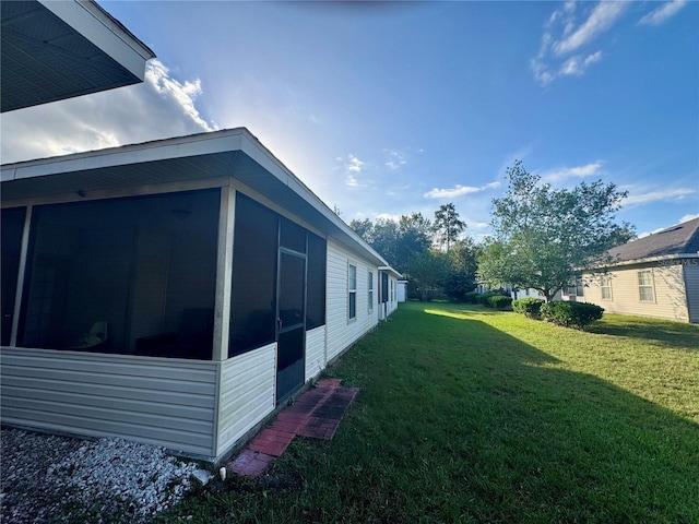 view of yard with a sunroom