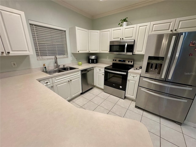 kitchen featuring ornamental molding, stainless steel appliances, sink, light tile patterned floors, and white cabinets