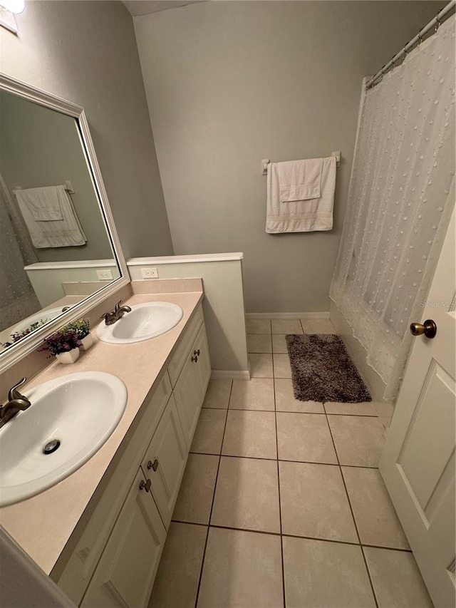 bathroom with vanity and tile patterned floors