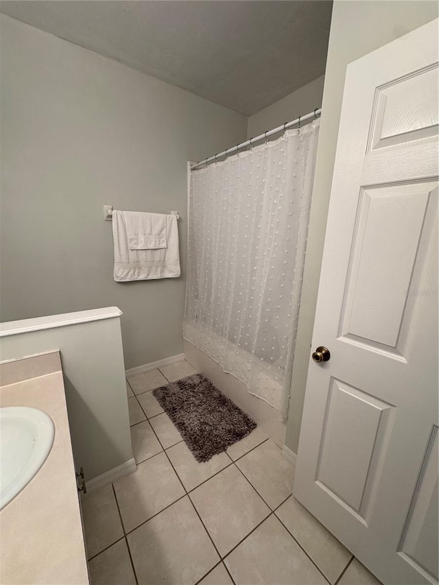 bathroom with vanity and tile patterned floors