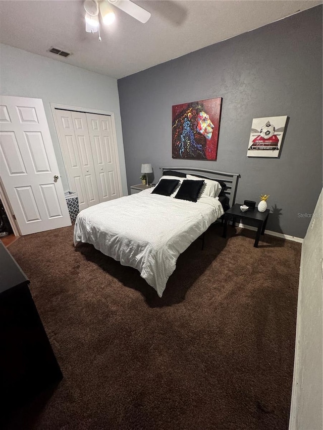 bedroom with ceiling fan, a closet, and carpet