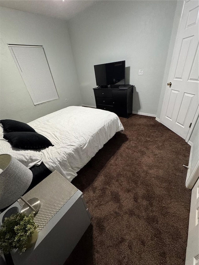 bedroom with dark carpet