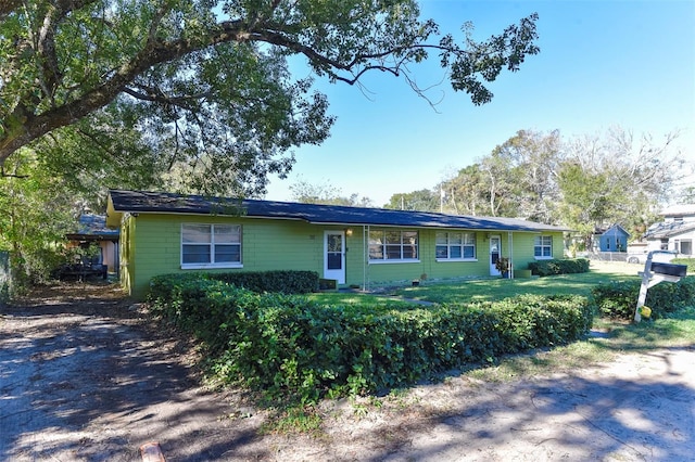 ranch-style home with a front yard