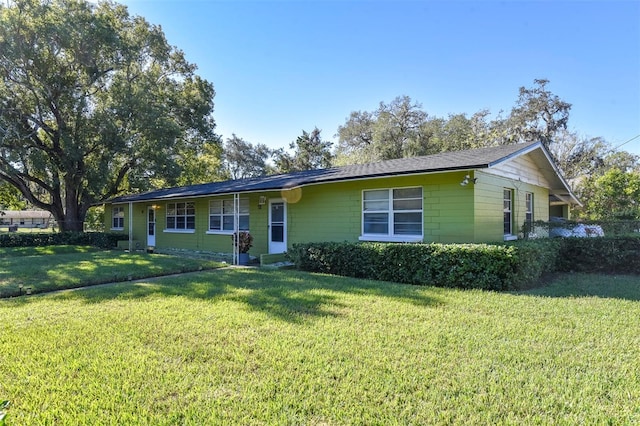 single story home with a front yard