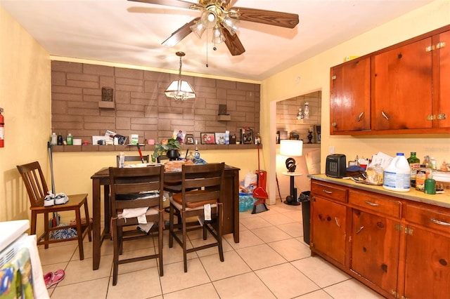 kitchen with decorative light fixtures, ceiling fan, and light tile patterned floors