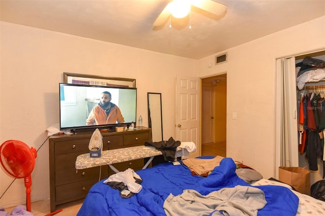 bedroom featuring ceiling fan and a closet